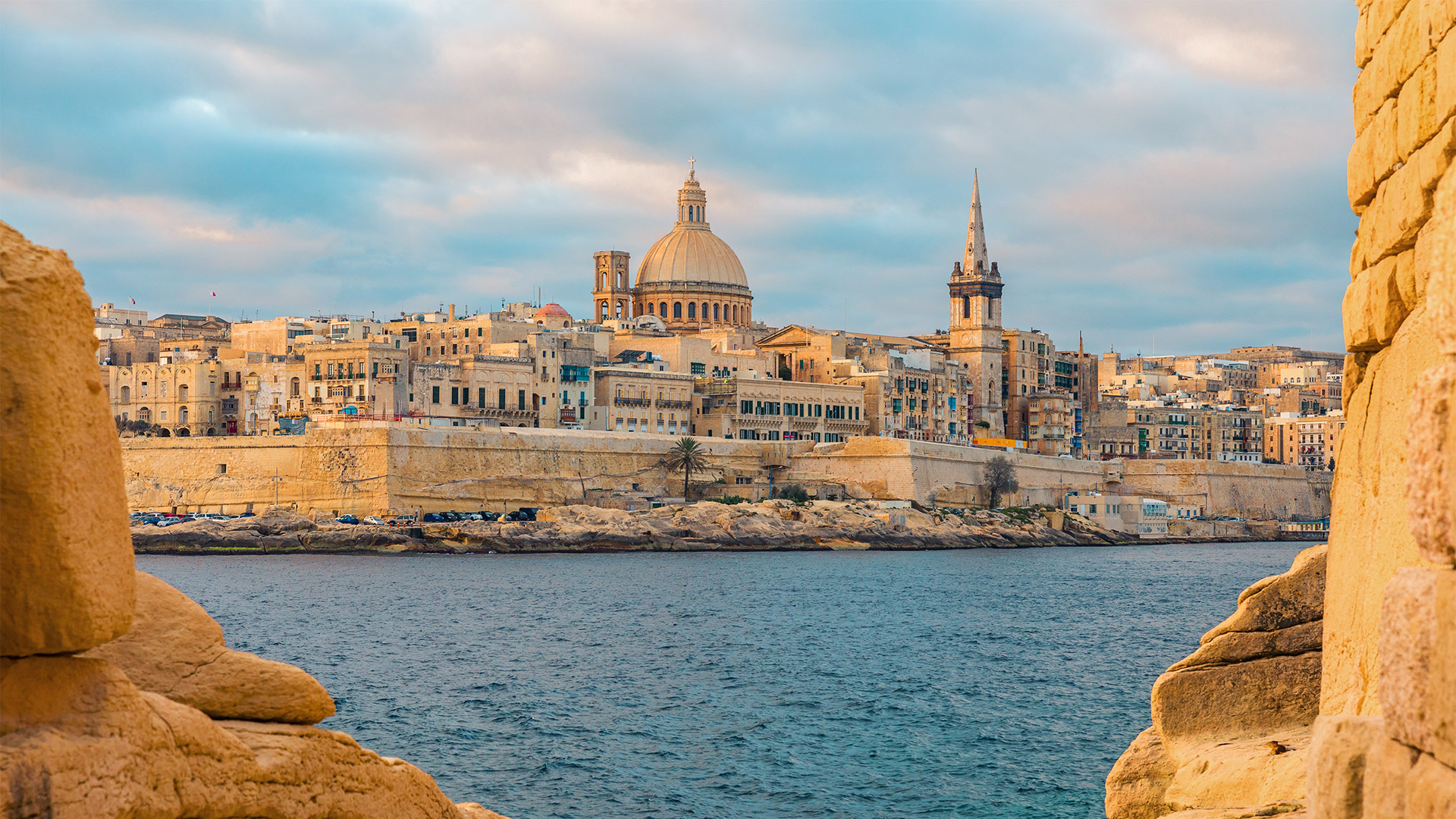 View of Valletta, Malta old town skyline from Sliema city on the other side of Marsans harbor during sunrise