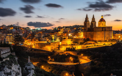 Il-Mellieha, Malta - illuminated Mellieha town at blue hour with Paris Church on hill top.